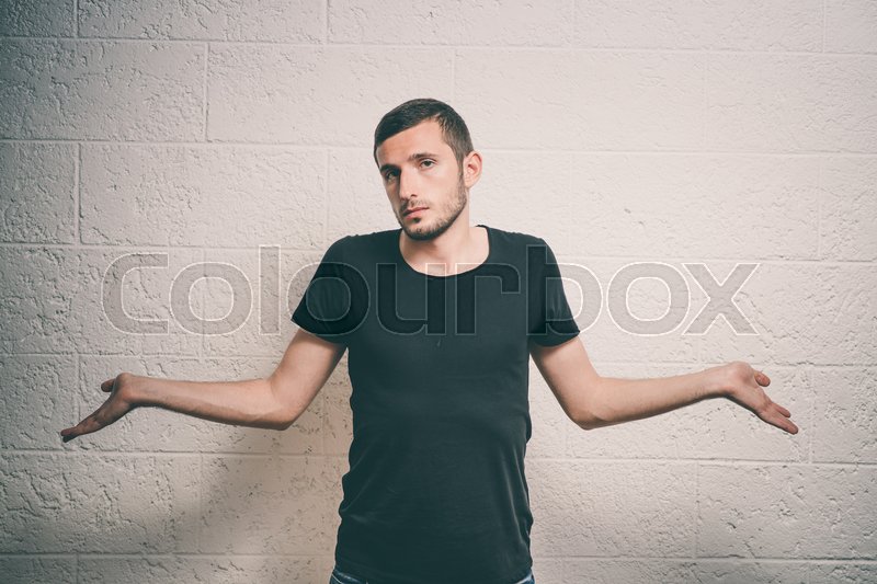 Man throws up his hands Stock image Colourbox