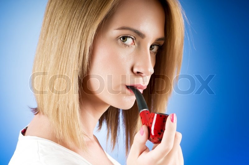 girl smoking pipe against the gradient background stock photo