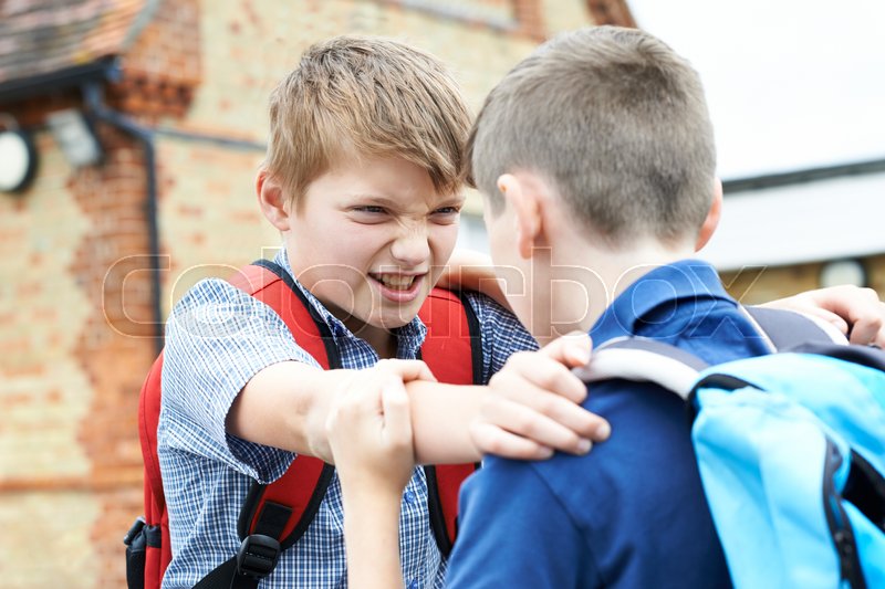 children fighting on playground