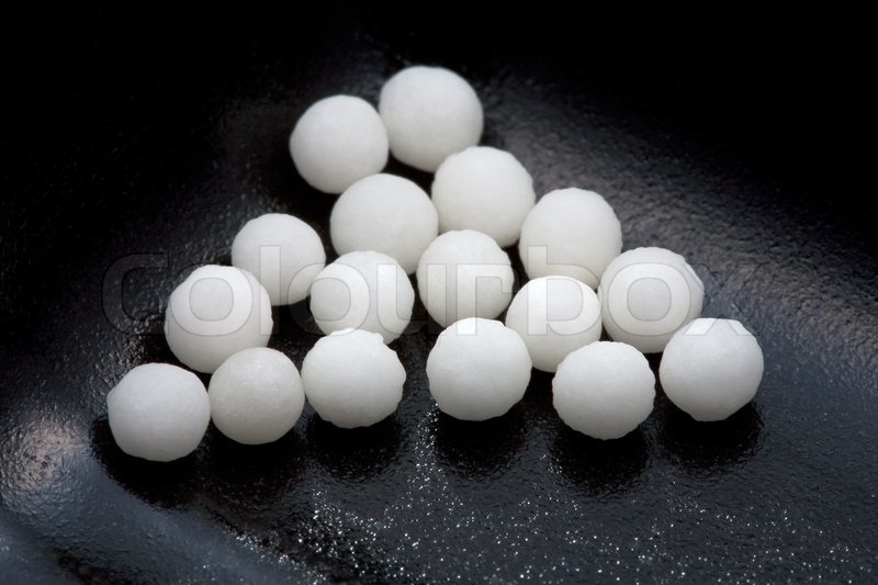 sugar homeopathy balls in black container close up stock photo colourbox sugar homeopathy balls in black container close up stock photo colourbox