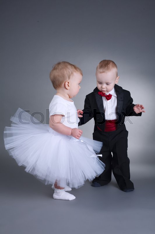 photo of cute boy and girl in wedding dress stock photo colourbox