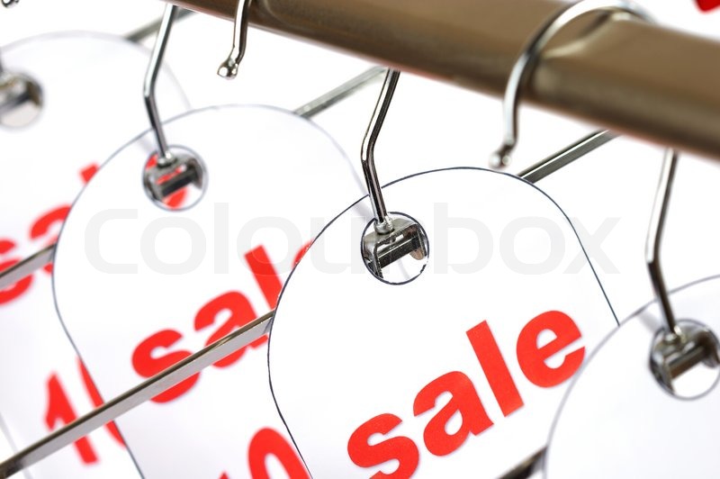 sale a hanger with labels on a white background stock photo