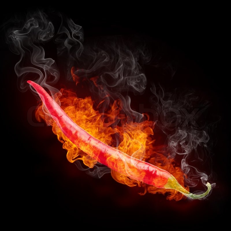 Hot Pepper in Fire Isolated on Black Background. Stock Photo Colourbox