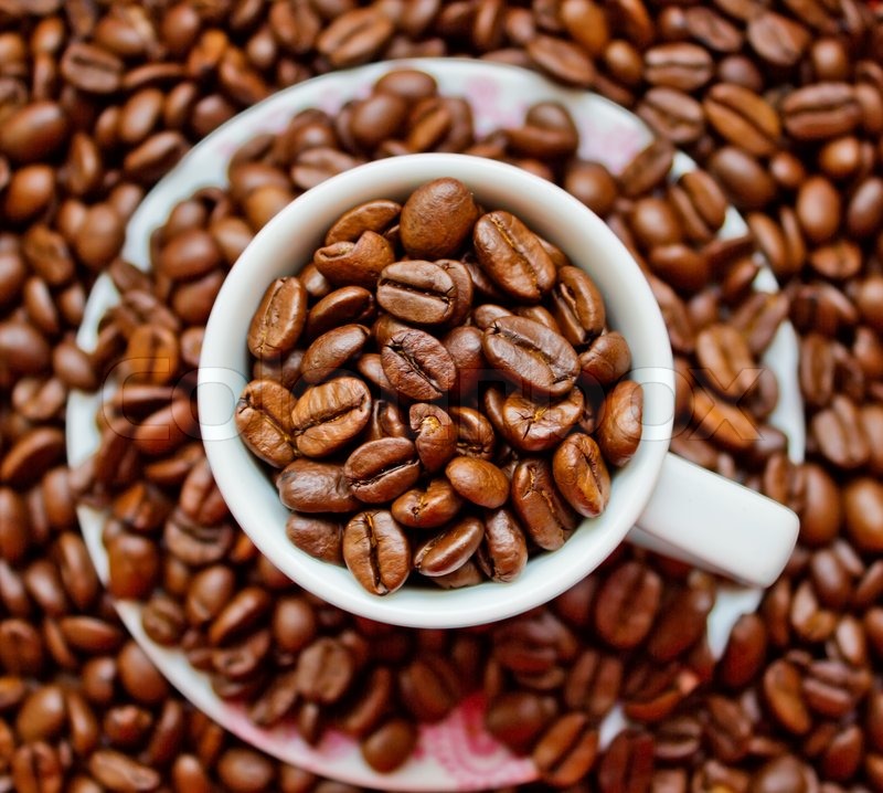 Coffe cup and plate filled with coffee Stock Photo Colourbox