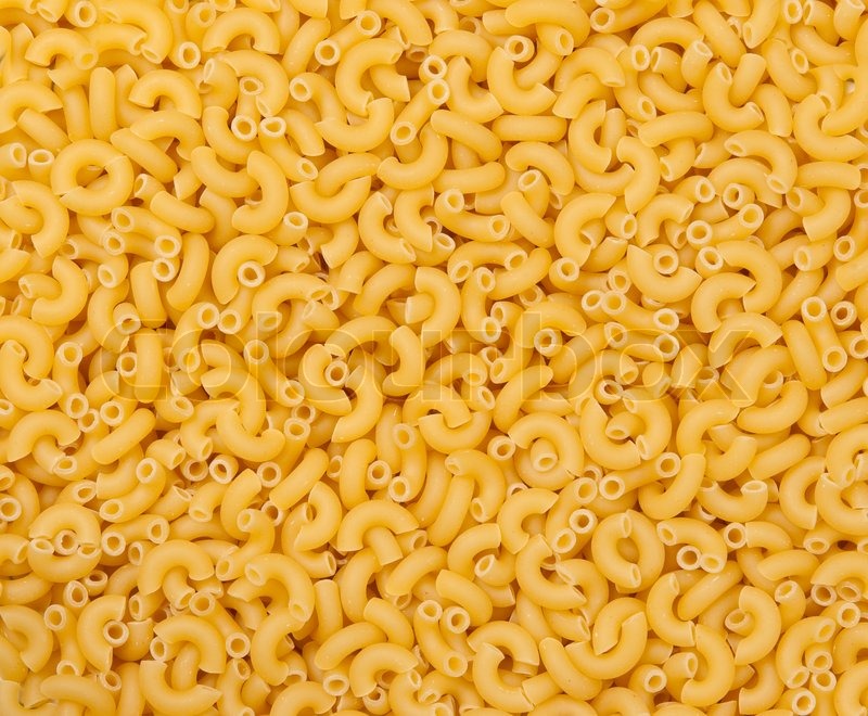 Raw yellow macaroni for background Stock Photo Colourbox