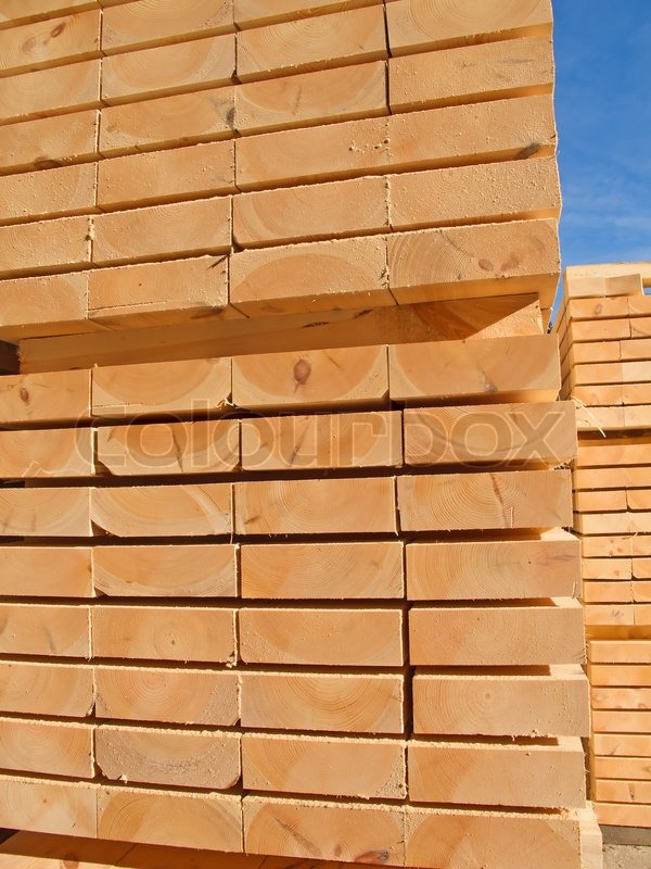 Stack of new wooden studs at the lumber ... | Stock image | Colourbox