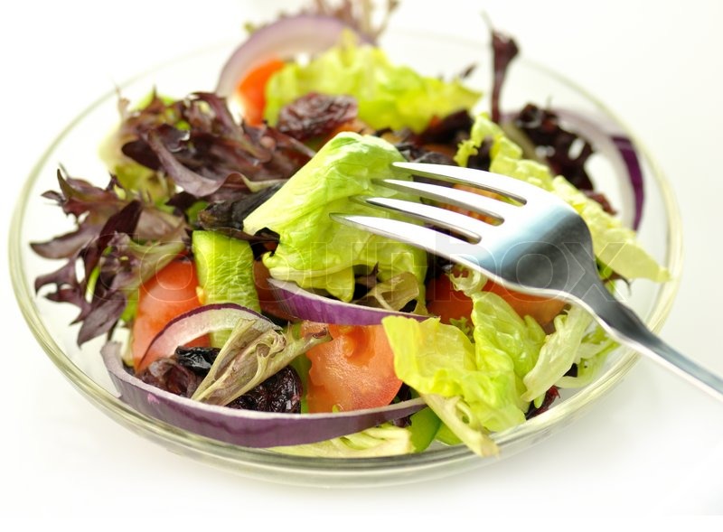 Fresh salad with fork close up Stock image Colourbox