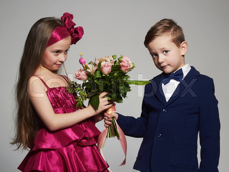 Boy Giving Girl Flowers Stock Photo 28761021 Alamy