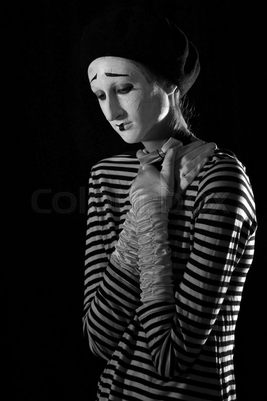 portrait of sad crying mime on black background portrait of a male