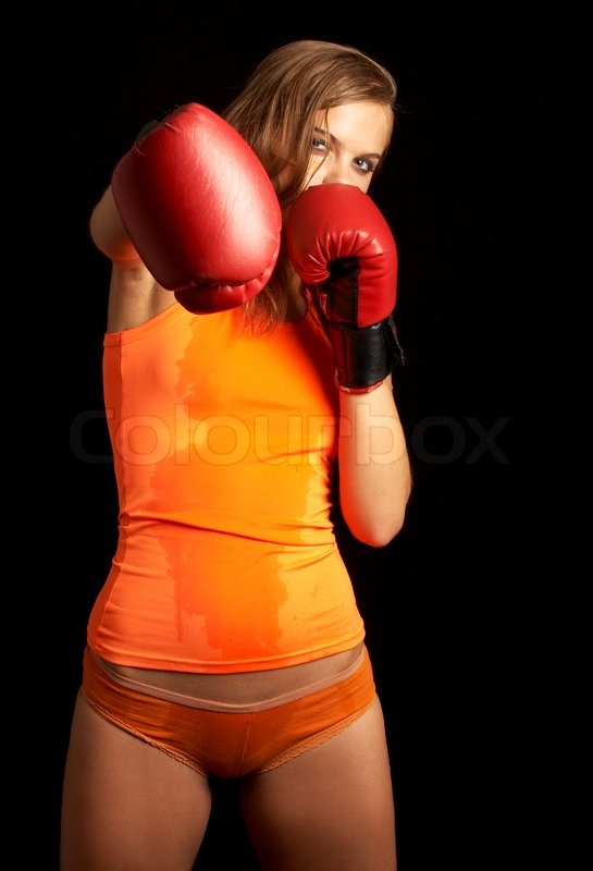 sporty girl in boxing gloves punching stock photo colourbox
