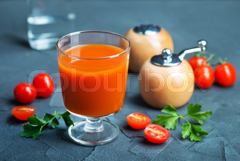 Tomato juice in glass and vodka on a Stock image Colourbox