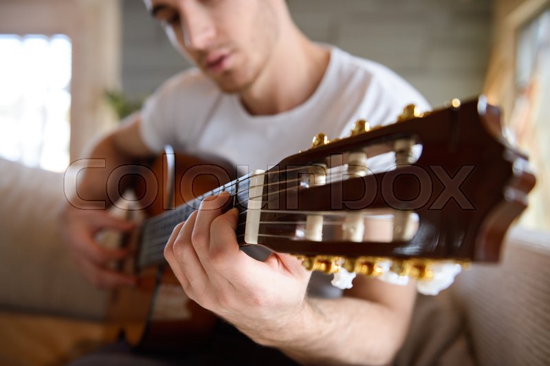 Close Up Shot Of Guitar In Hands Of Man Stock Image Colourbox