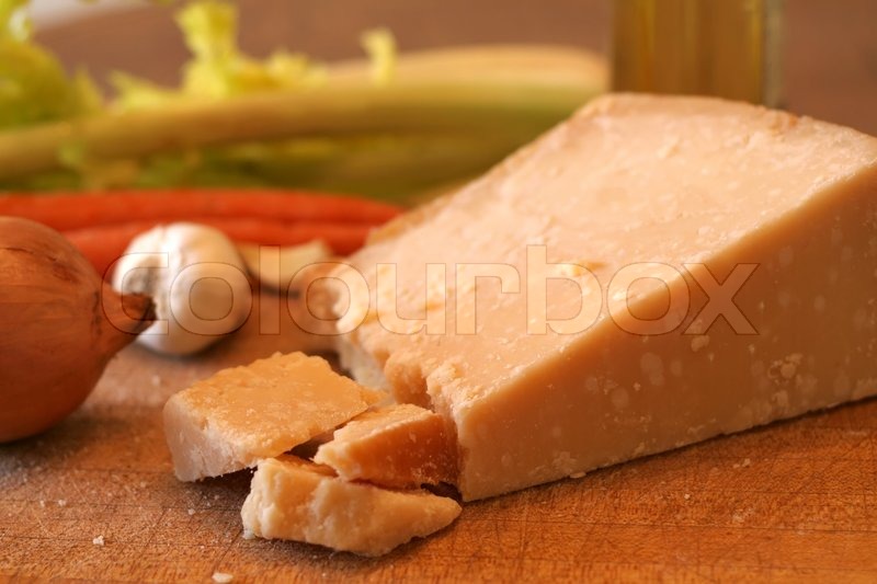 Block of parmesan cheese and fresh Stock Photo Colourbox