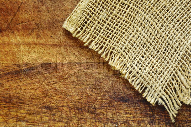 Wooden background with rough fabric | Stock image | Colourbox