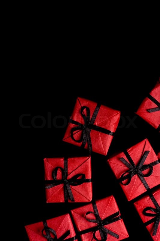 many red gift boxes on black background stock image gift black and white