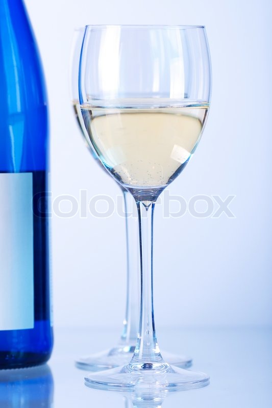 Blue bottle of white wine and two wine ... | Stock image | Colourbox