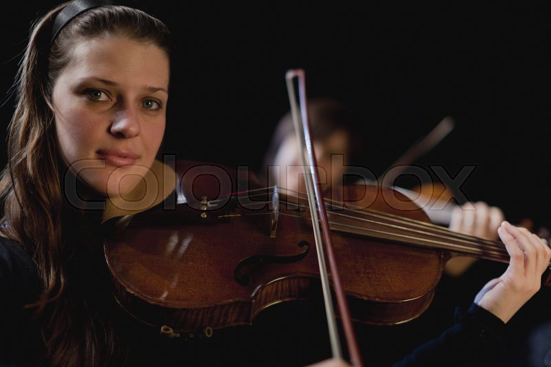 Violin player in orchestra | Stock image | Colourbox