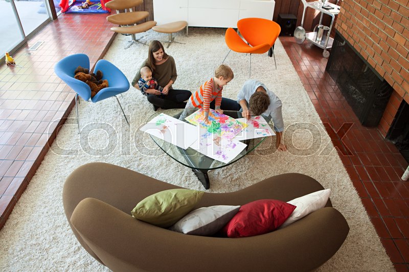 Family playing in living room | Stock image | Colourbox