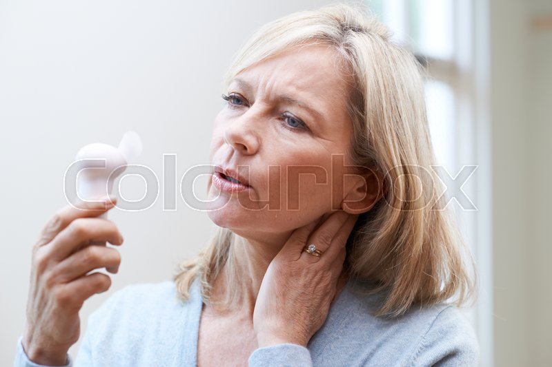 Mature Woman Experiencing Hot Flush Stock Image