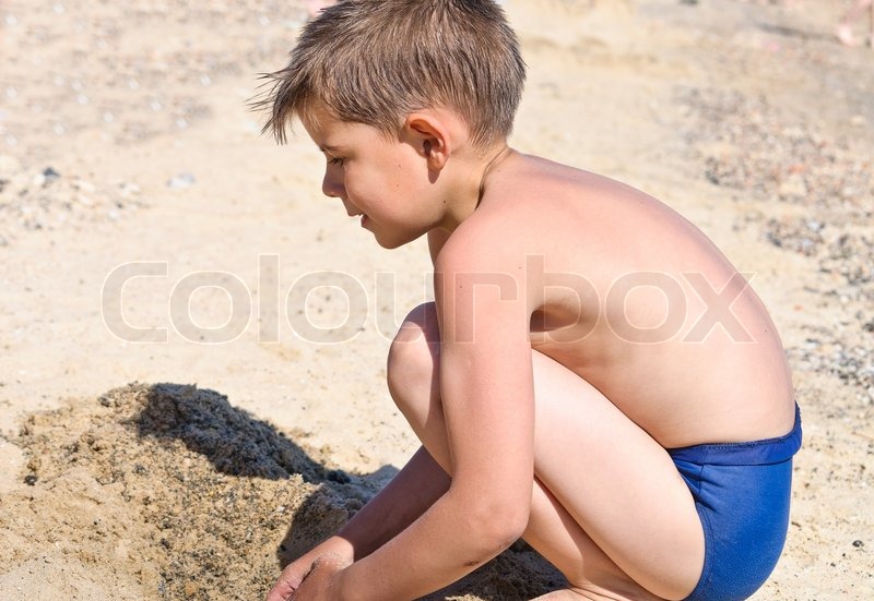 boy in swimming trunks