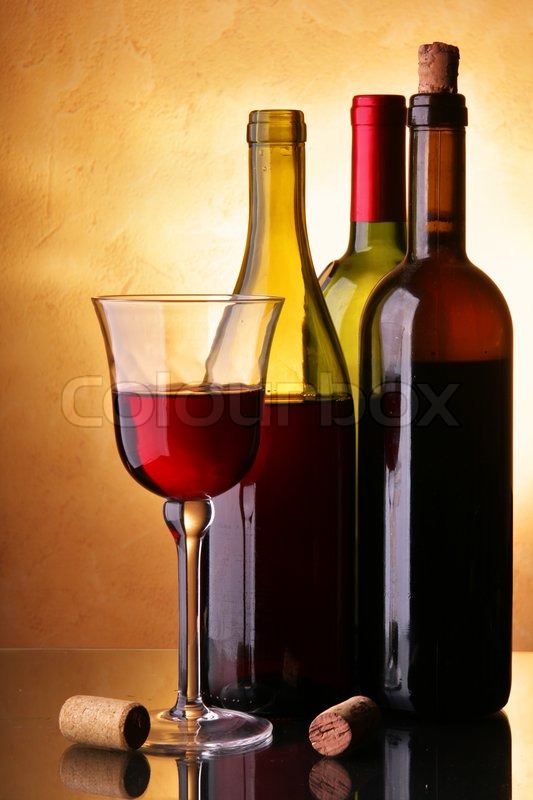 still life with three wine bottles and glass stock photo colourbox