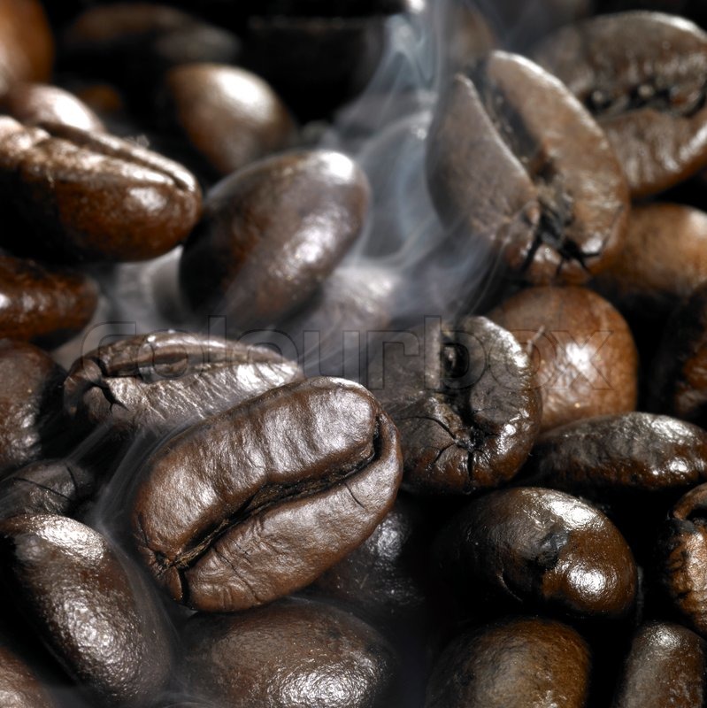 Roasted coffee beans and smoke Stock Photo Colourbox
