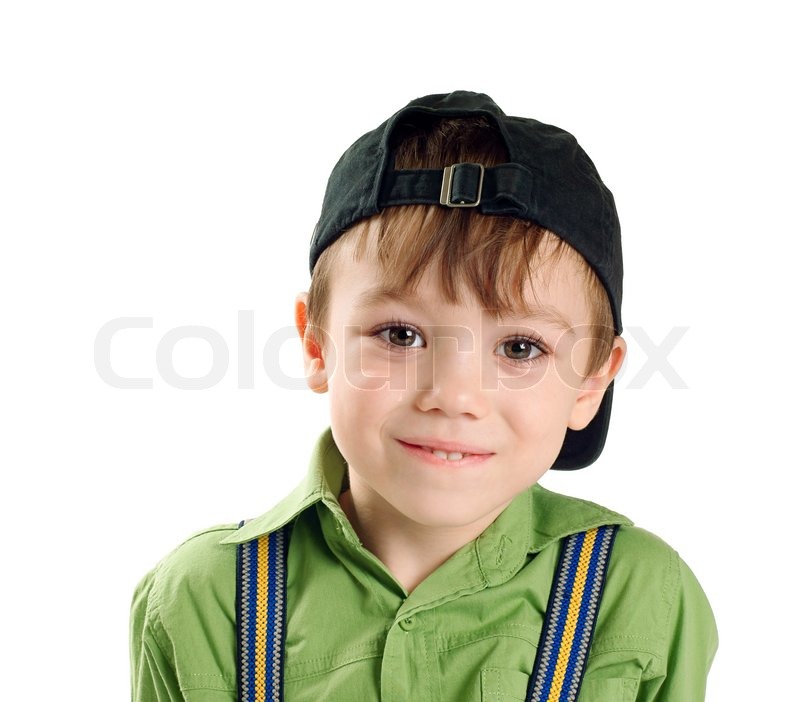portrait of small boy in baseball cap isolated on pure white
