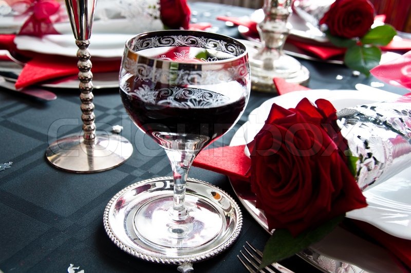 Festive table setting for Christmas with silver and red rose | Stock ... Festive table setting for Christmas with silver and red rose | Stock ...