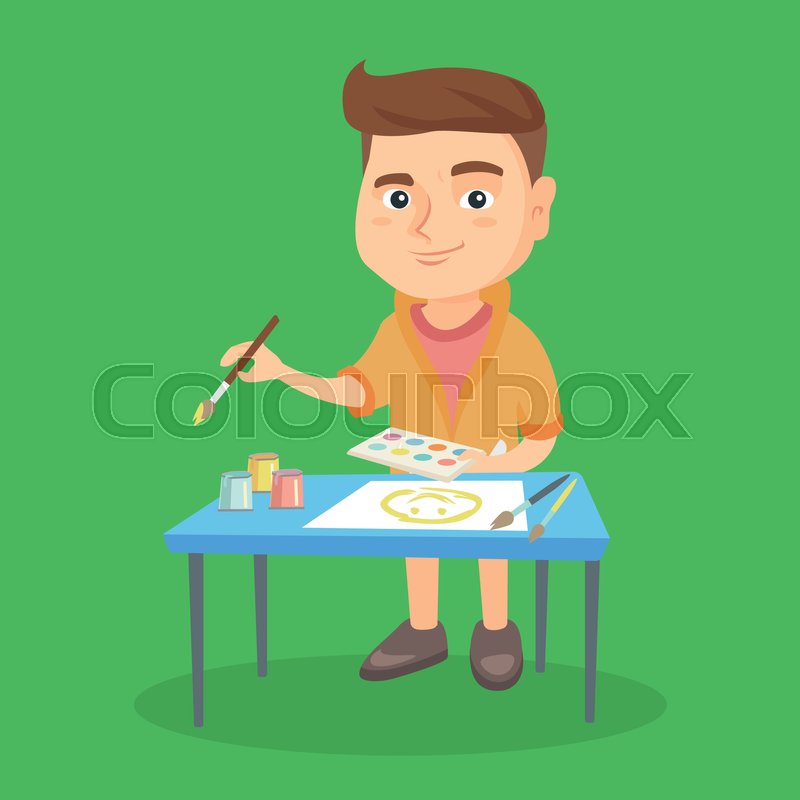 caucasian boy standing near the table and painting with a paint