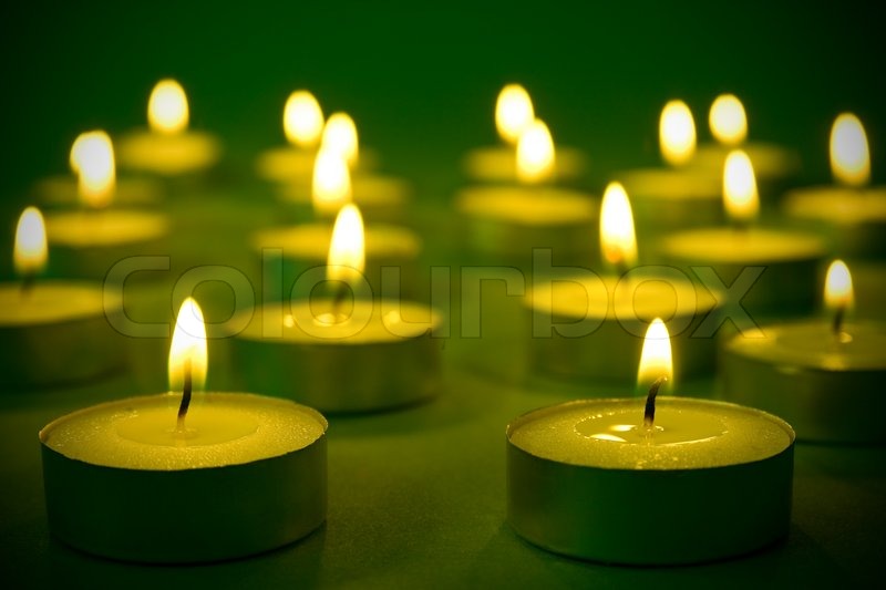 Group of warm burning candles on Stock image Colourbox
