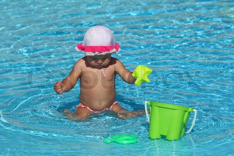 Cute Toddler Girl Playing In A Swimming Pool Stock Image Colourbox