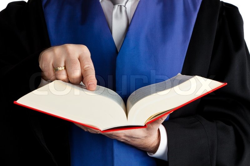 Ein Richter mit einem Gesetzbuch vor Stock Bild Colourbox