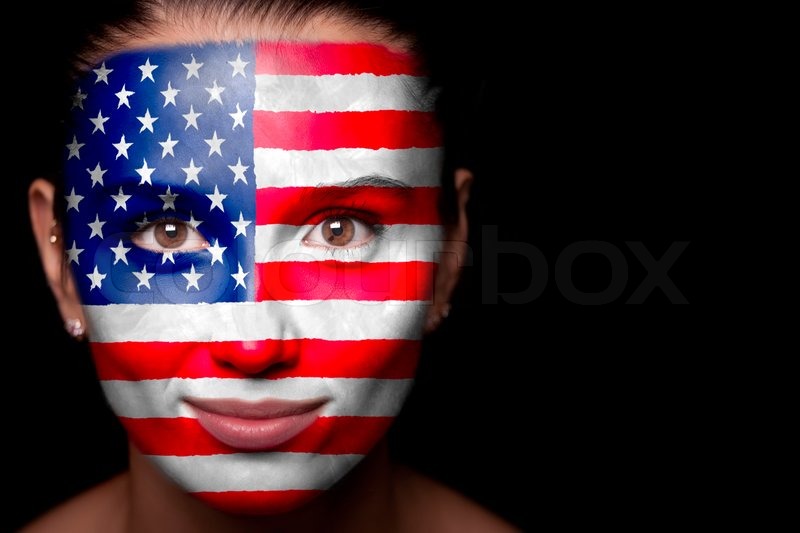 Portrait of a woman with the flag of the USA painted on ...