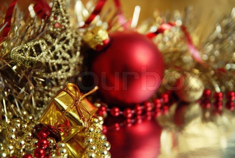 still life of red and gold christmas ornaments in the foreground a small gift stock photo colourbox - Red And Gold Christmas Ornaments still life of red and gold christmas ornaments in the foreground a small gift stock photo colourbox - Red And Gold Christmas Ornaments