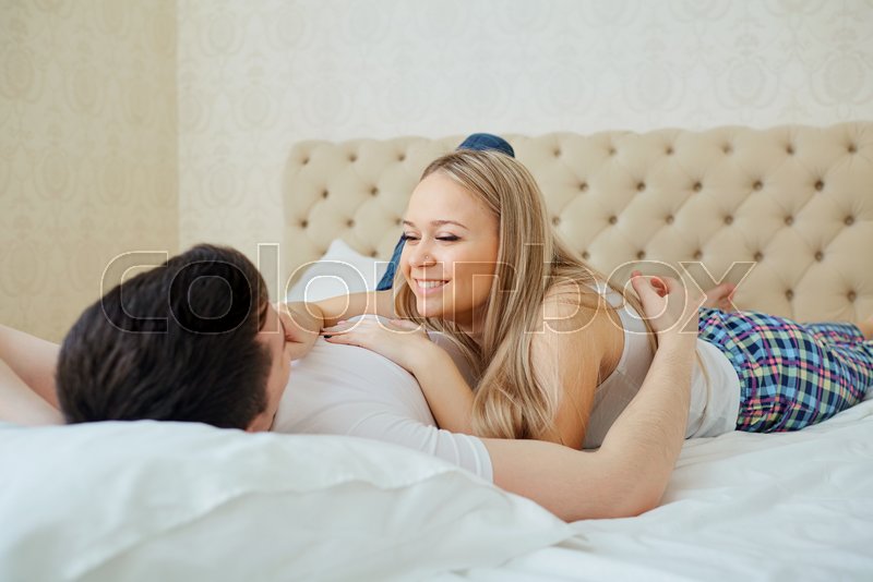 Couple In Bed Hugging In Bedroom Stock Image Colourbox