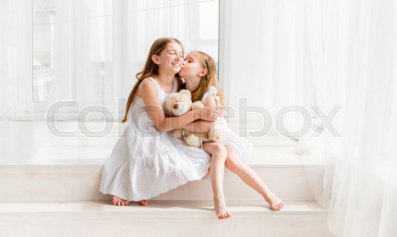 Two Cute Little Girls In White Dresses Stock Image Colourbox