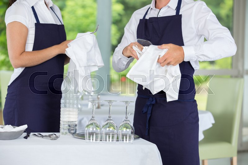 Waiters cleaning glasses in a ... | Stock image | Colourbox