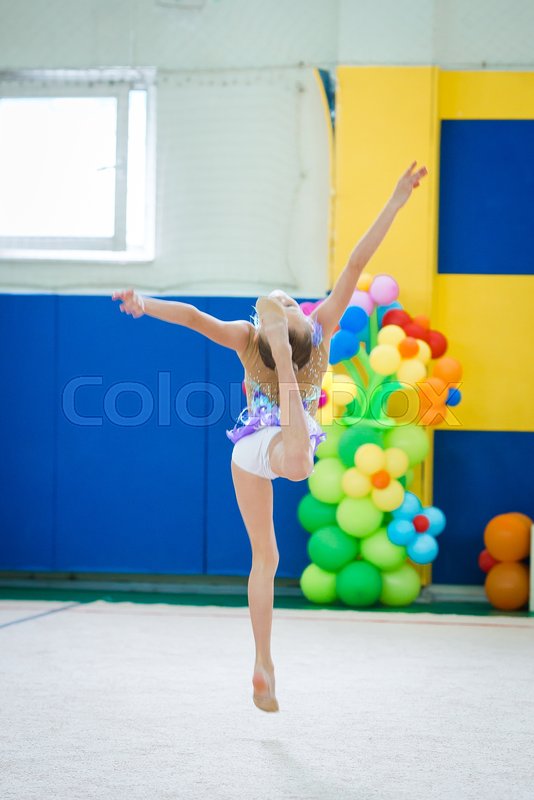 Beautiful little active gymnast girl ... | Stock image | Colourbox