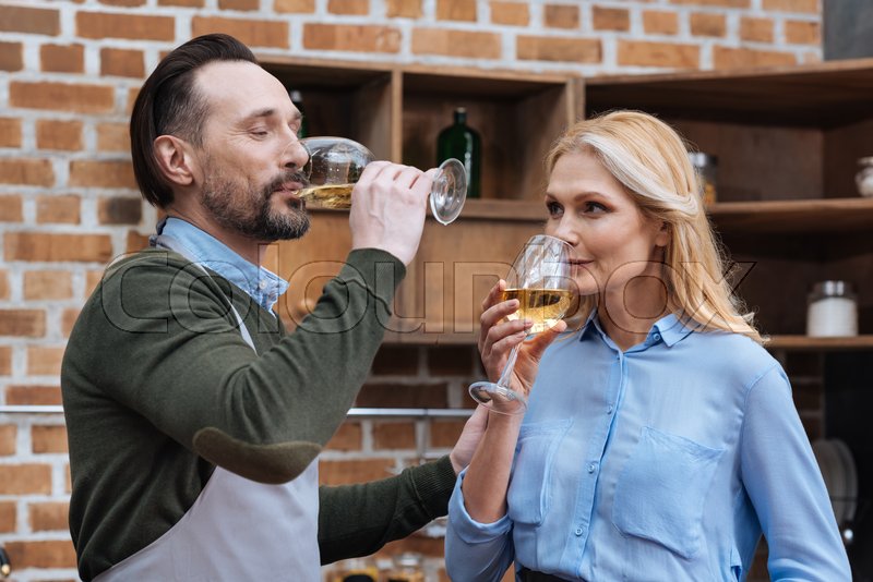 Husband and wife drinking wine from | Stock image | Colourbox