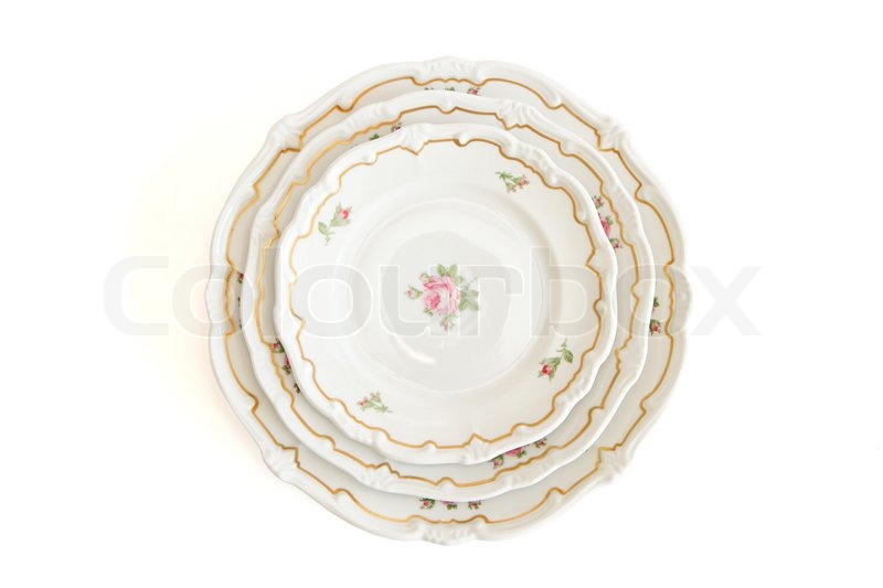 Stack of three white dinner plates and | Stock image | Colourbox