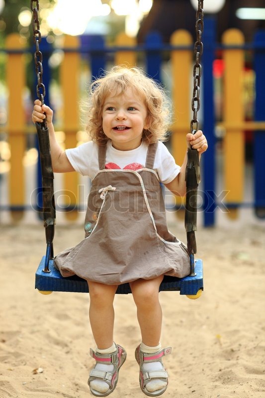 child on swing in