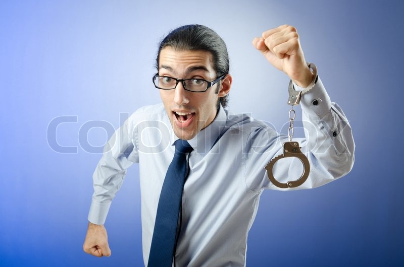 Businessman with handcuffs running away Stock image Colourbox