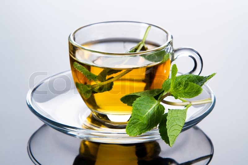 Tea cup with fresh mint leaves, closeup ... | Stock image | Colourbox