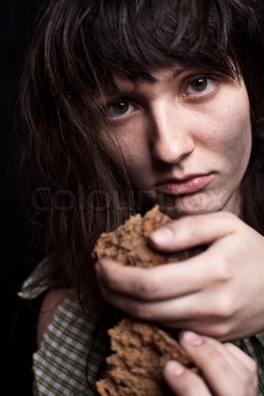Portrait Of A Poor Beggar Woman With A Piece Of Bread In Her Hands Portrait Of A Poor Beggar Woman With A Piece Of Bread In Her Hands