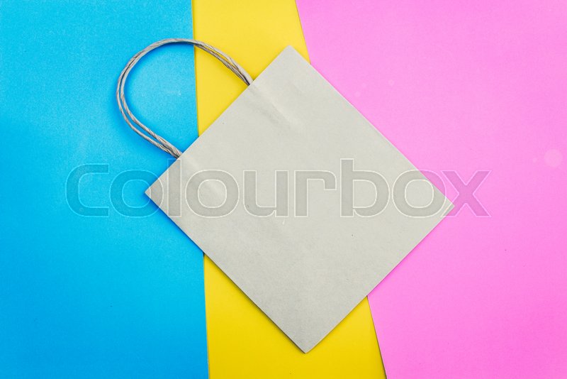 Brown paper bag on colourful background | Stock image | Colourbox