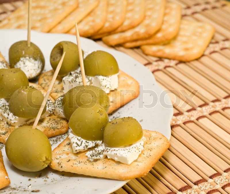 Crackers with olives and cheese feta Stock image Colourbox