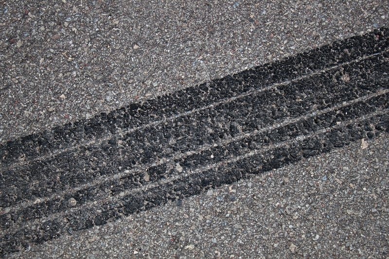 Tire track on asphalt | Stock Photo | Colourbox