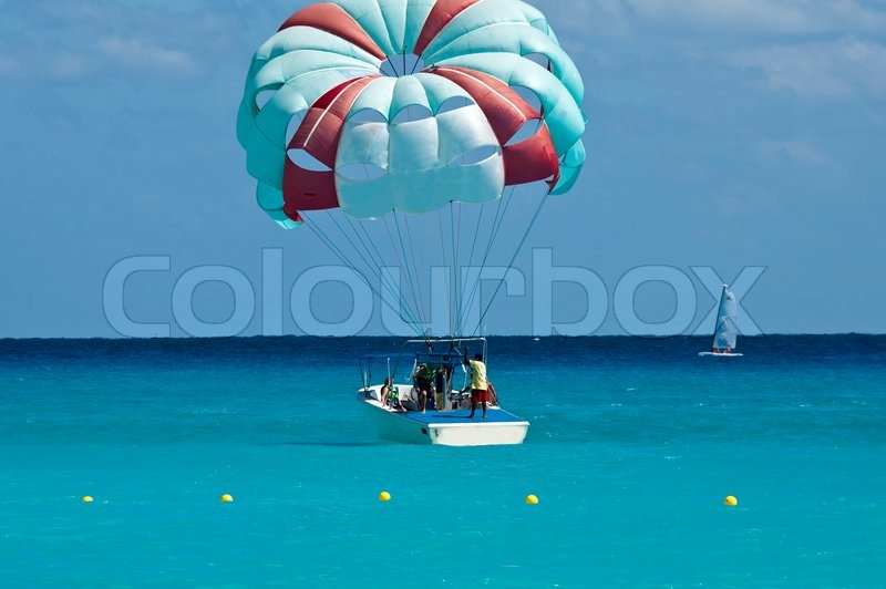 The parachuters are landed on a boat Stock image Colourbox