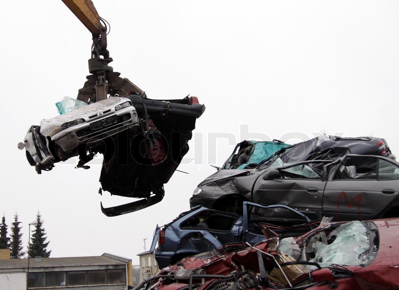 Car wreck being lifted by grab crane to ... | Stock image | Colourbox