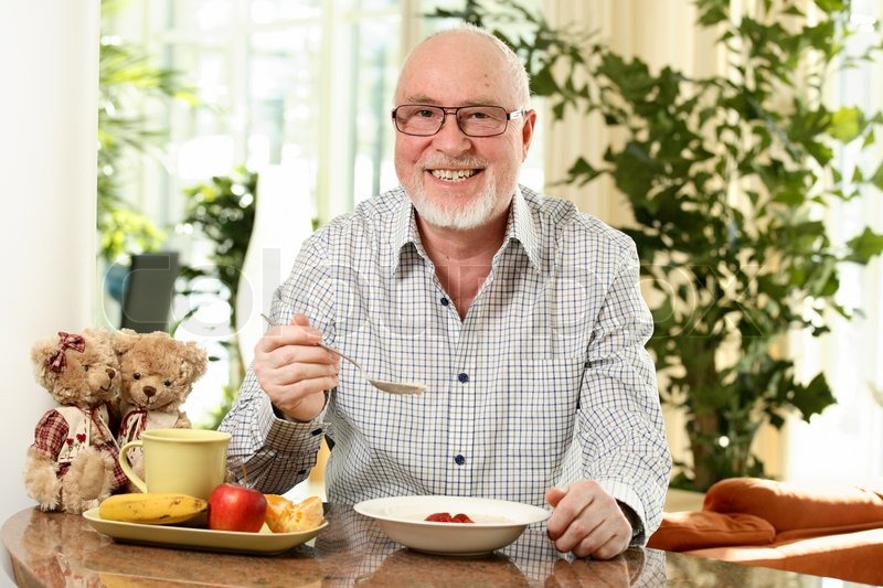 Oats For Senior Citizens Smiling senior man at lunch table | Stock image | Colourbox